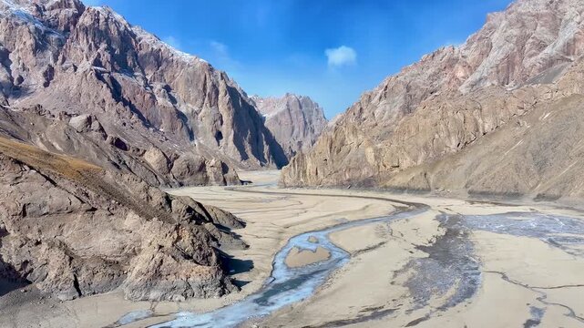 Braided Glacial River Flowing Through Dramatic Rocky Mountain Valley