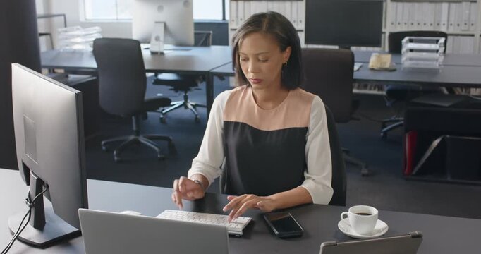 Lifestyle videos indoor of people doing activities at office, typing on keyboard, woman working at d