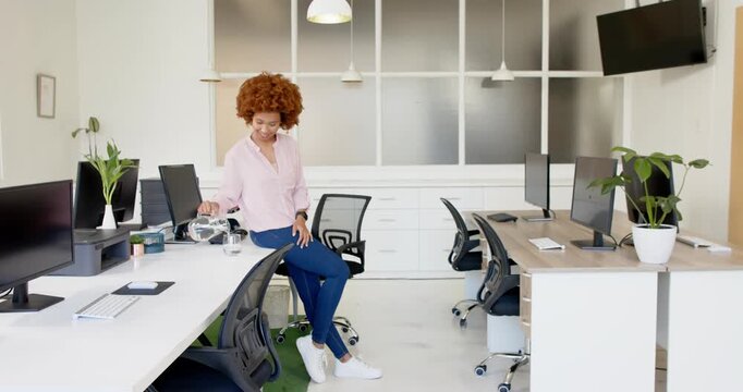 Lifestyle videos indoor of people doing activities at office, woman standing in modern office with c