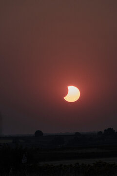 View of the partial solar eclipse, during partiality, in the countryside around San Juan del Monte, Burgos
