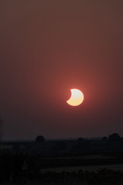 View of the partial solar eclipse, during partiality, in the countryside around San Juan del Monte, Burgos
