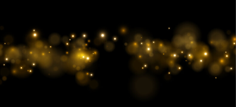 Soft golden bokeh lights glow against a black background. The lights have a scattered, diffused pattern with varied intensity and size. This image is ideal for festive, celebratory, or.