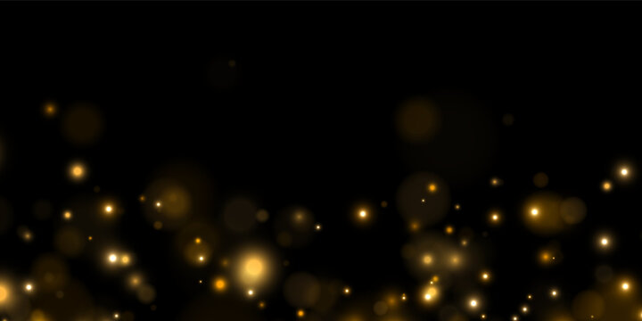 Scattered golden bokeh lights glow softly against a deep black backdrop. The lights vary in size and intensity creating a warm and dreamy atmosphere. This effect is perfect for festive.