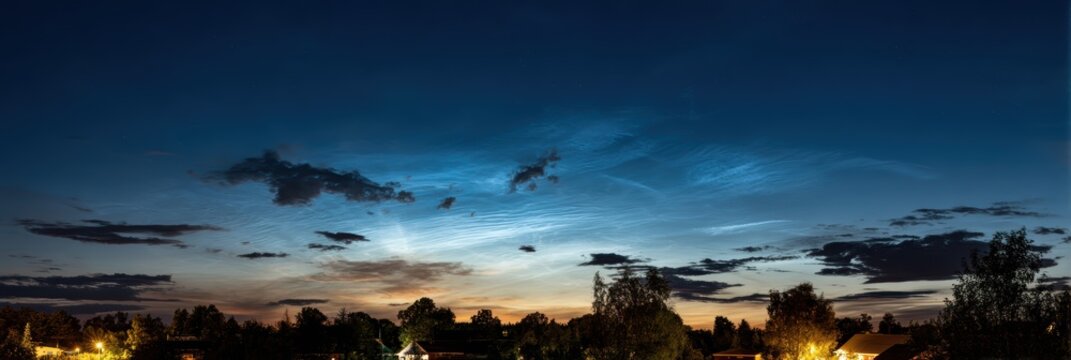 Summer night sky featuring rare luminous clouds, a unique meteorological event with bright formations shining at night due to sunlight reflecting off ice crystals in the cold mesosphere