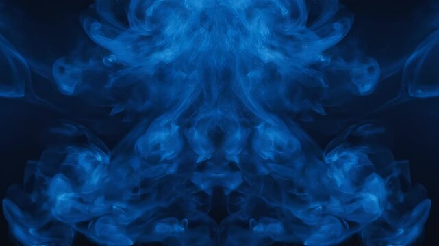 Blue smoke wisps forming symmetrical patterns in darkness with subtle camera movement for abstract backgrounds