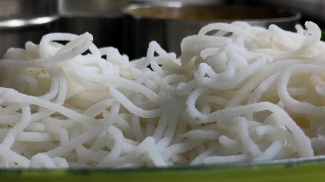 Idiyappam, also known as indiappa, noolappam, noolputtu, sheveo, santhagai, or ottu shavige, is a string hopper dish originating from southern India. It consists of rice flour pressed into noodles.