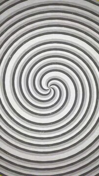 Hypnotic black and white spiral spinning with vintage scan line effect.