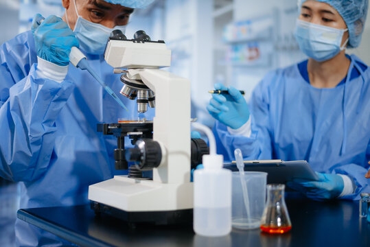 Medical team having a meeting with doctors. Young scientists conducting research investigations in a medical laboratory