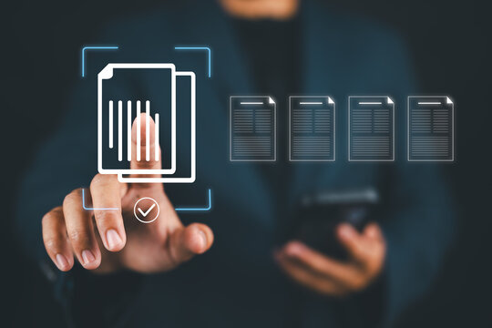 E-document management, online documentation database, paperless office concept, Businessman touching on document for online approve paperless quality assurance and ERP management concept.