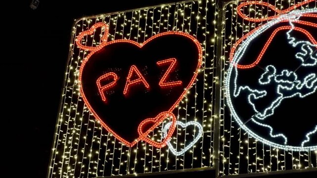 Flashing christmas lights with paz neon sign