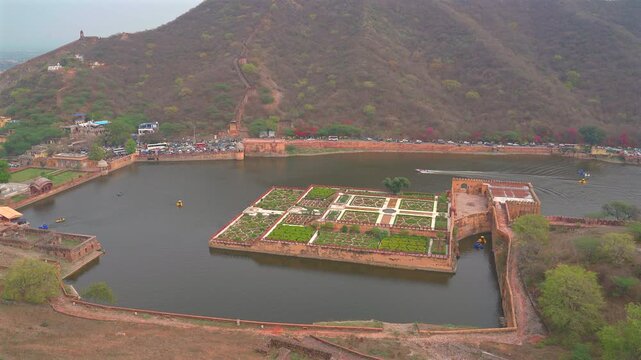High angle wide shot of the geometric Kesar Kyari garden on Maota Lake below Amer Fort in Jaipur, Rajasthan, India.