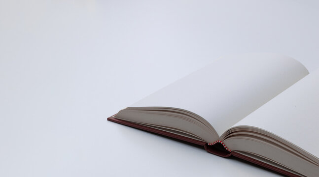 Open Book with Blank White Pages on a Minimal Background