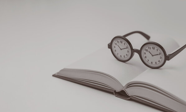 Taking Time to Read with an Open Book and Clock Glasses