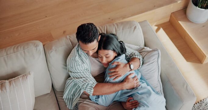 Laptop, hug and couple on sofa in home with bonding, connection and affection in marriage together. Happy, computer and woman embracing man in living room for support in relationship in apartment.