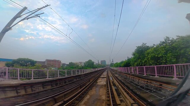 Title: The view from the last coach of a driverless metro train and a video created by reversing the footage.