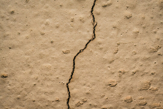 Cracked earth cement wall surface texture background