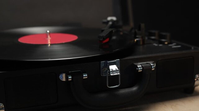 Vintage record player with a cup of coffee on a wooden table