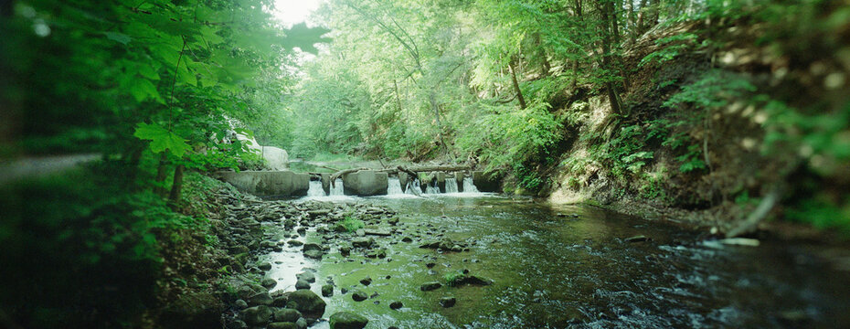 Panoramic view of a scenic stream flowing through Saratoga Spa State Park, New York 