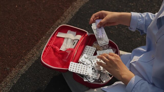 First aid kit. Sports ground. Rubber flooring. Slow motion video. High quality 4k footage