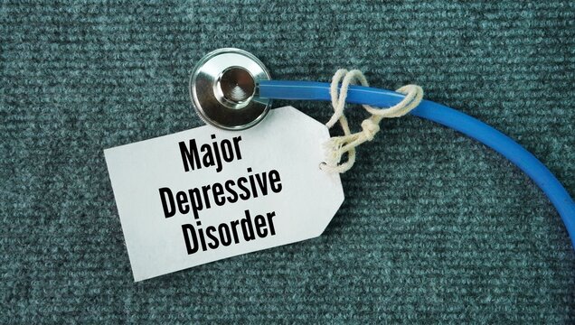 Stethoscope and paper tag with the words Major Depressive Disorder. common medical condition that causes a persistent sad mood and a loss of interest in activities for at least two weeks