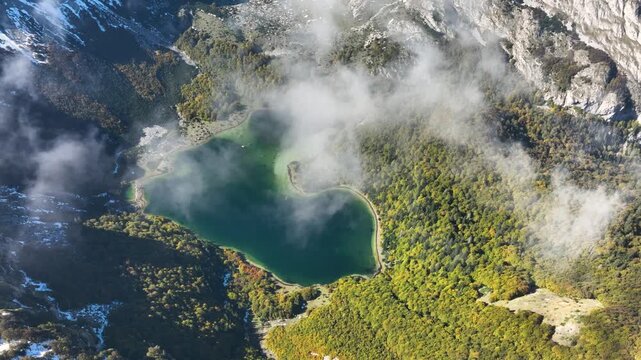 Aerial view of Trnovačko Lake, a heart-shaped lake in the mountains of northern Montenegro