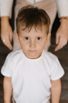 Little Boy Looking at Camera with Serious Expression