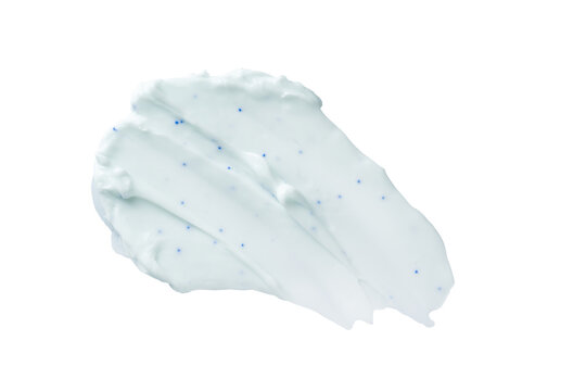 Blue exfoliating cosmetic cream smear with microbeads isolated on transparent background, skincare cleansing scrub or toothpaste texture sample for beauty product design.