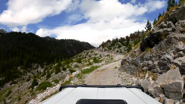 POV of an off-road vehicle driving on a bumpy mountain trail in the south of Montenegro