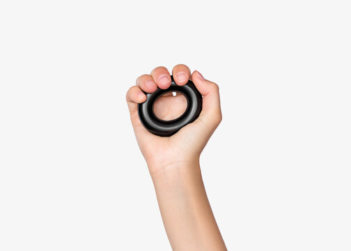 Hand Exercising with Grip Ring on Neutral Background
