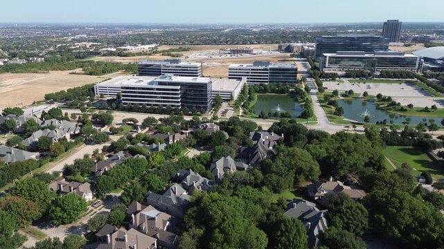 Aerated fountain ponds border Hall Park corporate buildings along Internet Boulevard. Custom Stonebriar Creek estates meet reflective office plazas near Warren Parkway, Frisco, Texas