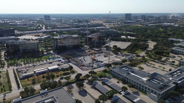 Heavy foundation rigs drive structural supports across Hall Park plots near Warren Pkwy.. Excavated job sites expand commercial districts beside shaded parking off Internet Blvd., Frisco, TX