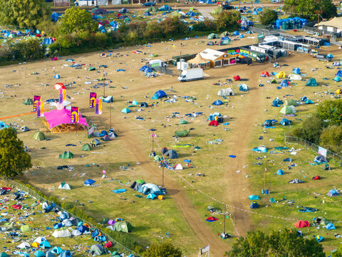 Reading, United Kingdom - 31 August 2026: Aerial view of Reading Festival campsite with numerous colorful tents scattered across the grassy field, pathways, and event infrastructure.