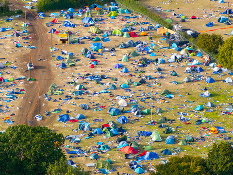Reading, United Kingdom - 31 August 2026: Aerial view of the Reading Festival campsite filled with numerous colorful tents scattered across the grassy field, showing the aftermath of the event.