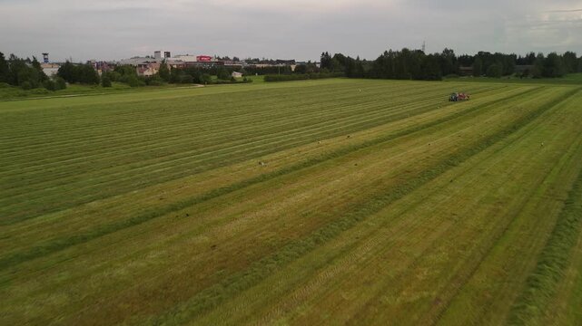 Drone Moving in for a Close-Up as the Hay Tedder Works