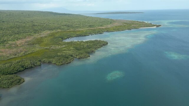 Tropical Lagoon And Blue Coastal Water Near Singaraja West Bali Indonesia Drone Track Overhead 4K 60FPS