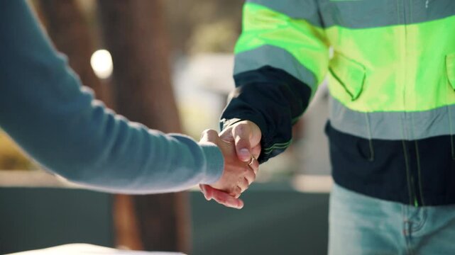 Handshake, meeting and construction team outdoor with building, repairs or renovation deal. Inspection, people and contractor shaking hands with civil engineer for negotiation on property remodeling.