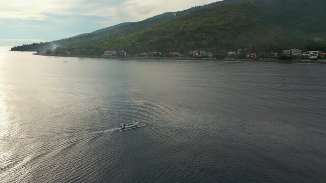 Mountains Roll Into Ocean Amed Beach Bali Island Indonesia Drone Track Left 4K 60FPS