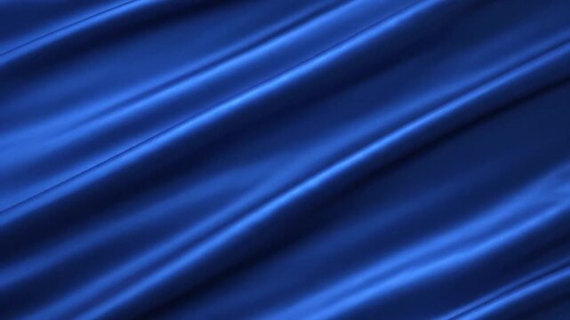 Abstract blue silk fabric texture with soft waves and elegant folds