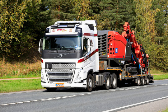 Volvo FH 500 truck transports Sandvik Leopard DI450 Down The Hole Drill Rig on the road.
