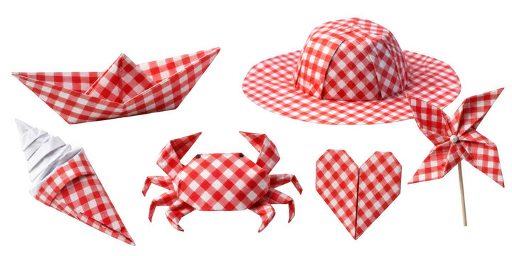 Red checkered origami picnic items including a boat crab hat heart and pinwheel during daylight