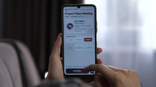 Freelancer prepares a smartphone video meeting with a client, reviews feedback priorities, checks camera, microphone and connection, then enters the remote project call.