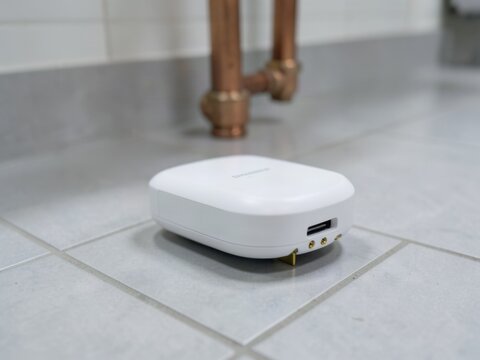 Wireless Smart Water Leak Sensor on Tile Floor Still Life