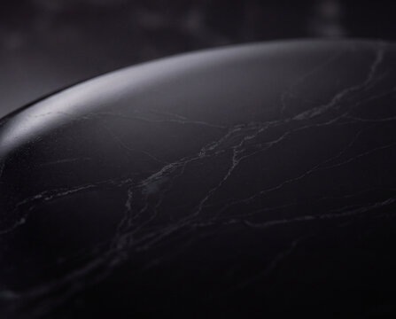 Black marble stone texture background with elegant dark veins and smooth polished surface.