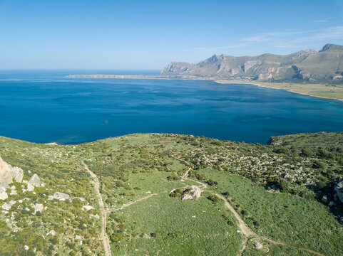Drone photo from Monte Cofano toward San Vito lo Capo on a sunny day, Sicily, Italy