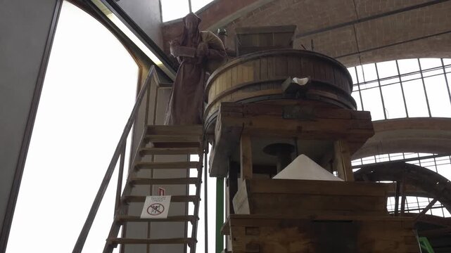Museum machine mill worker grain statue agriculture low angle retro wood