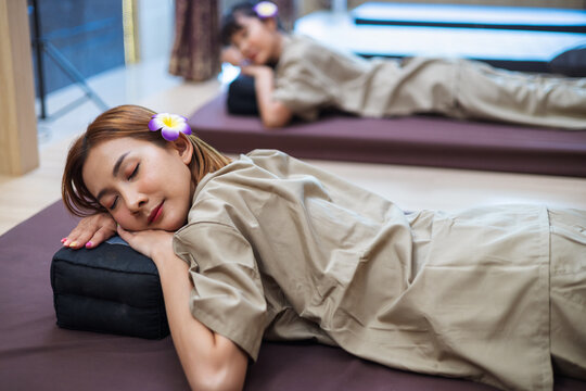Woman rests peacefully on massage table
