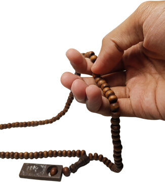 hand holding brown wooden prayer beads or tasbih