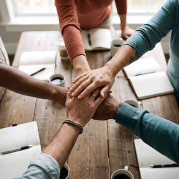 Diverse Hands Stacked Together In Team Huddle