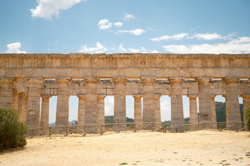 Fototapeta premium Horizontal side elevation view of Doric colonnade of ancient Greek temple in Segesta, Sicily, Italy