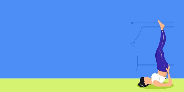 Woman practicing shoulder stand yoga pose with spacious background copyspace
